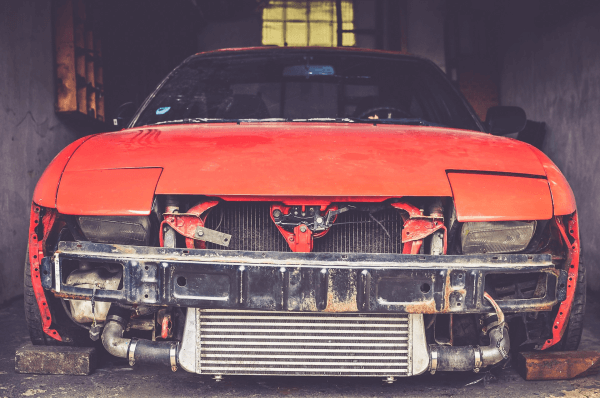 damaged red pontiac